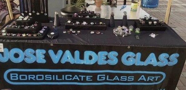 Jose Valdes displaying borosilicate glass art at Mallory Square