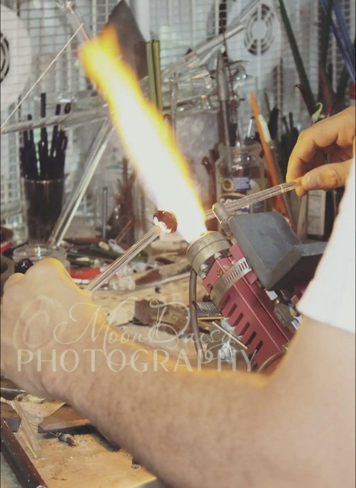 Jose Valdes working a red piece at the torch