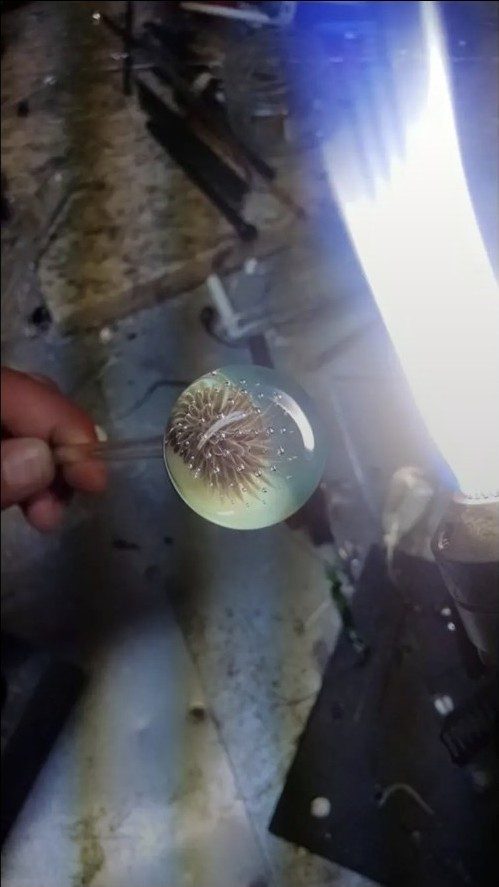 An implosion pendant being worked in the flame by Jose Valdes