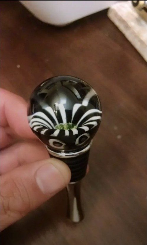 Black and white borosilicate glass bottle stopper by Jose Valdes