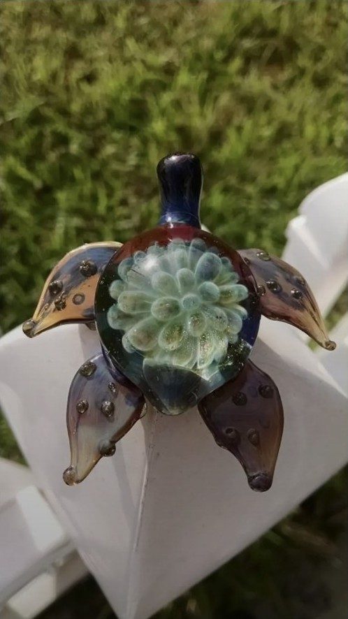 Pale green borosilicate glass turtle with a flower shell by Jose Valdes