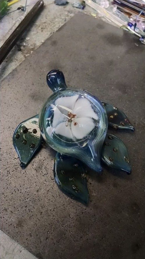 Blue borosilicate glass turtle with a white flower shell by Jose Valdes