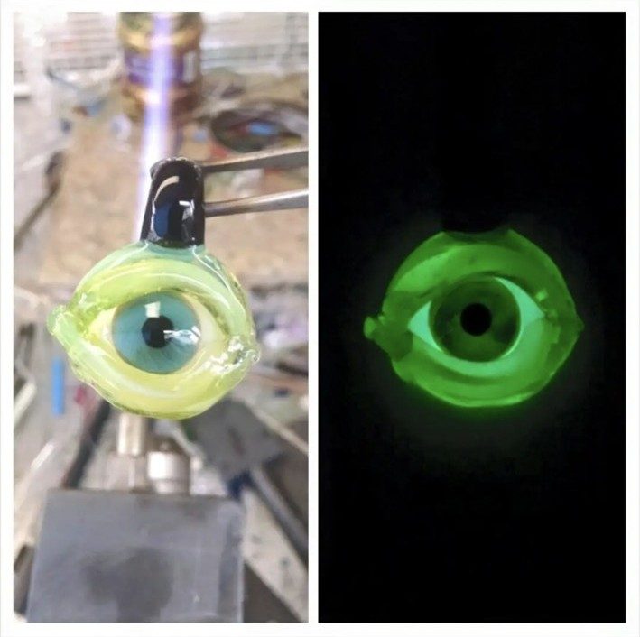 Glow-in-the-dark borosilicate glass eye pendant by Jose Valdes