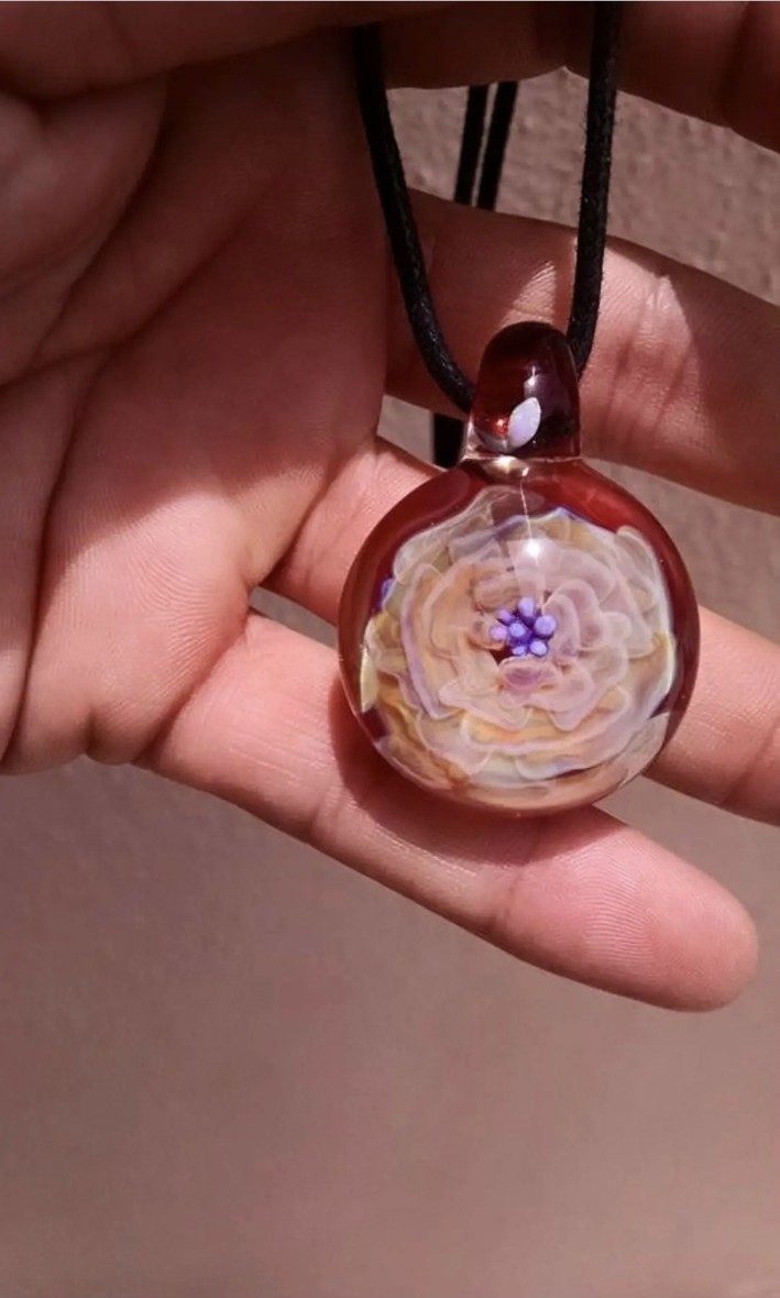 Red borosilicate glass flower implosion pendant by Jose Valdes