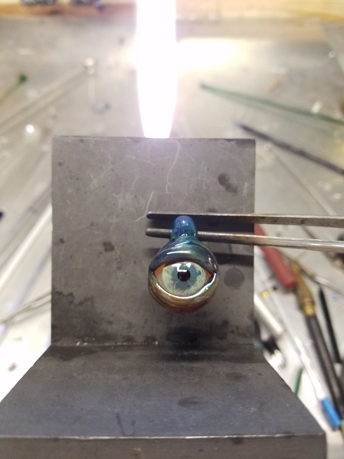 Glass pendant being made by Jose Valdes