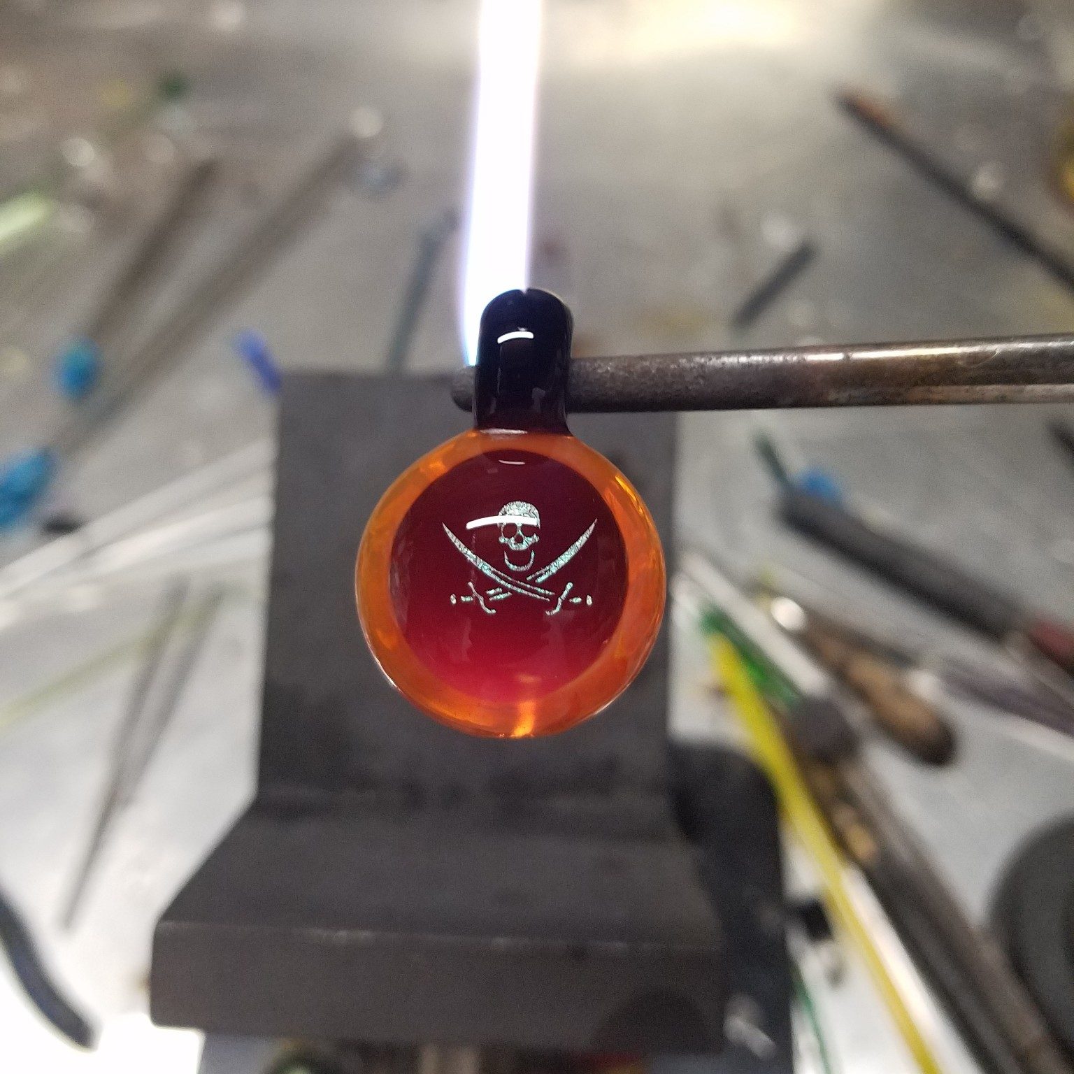 Glass pendant being made by Jose Valdes